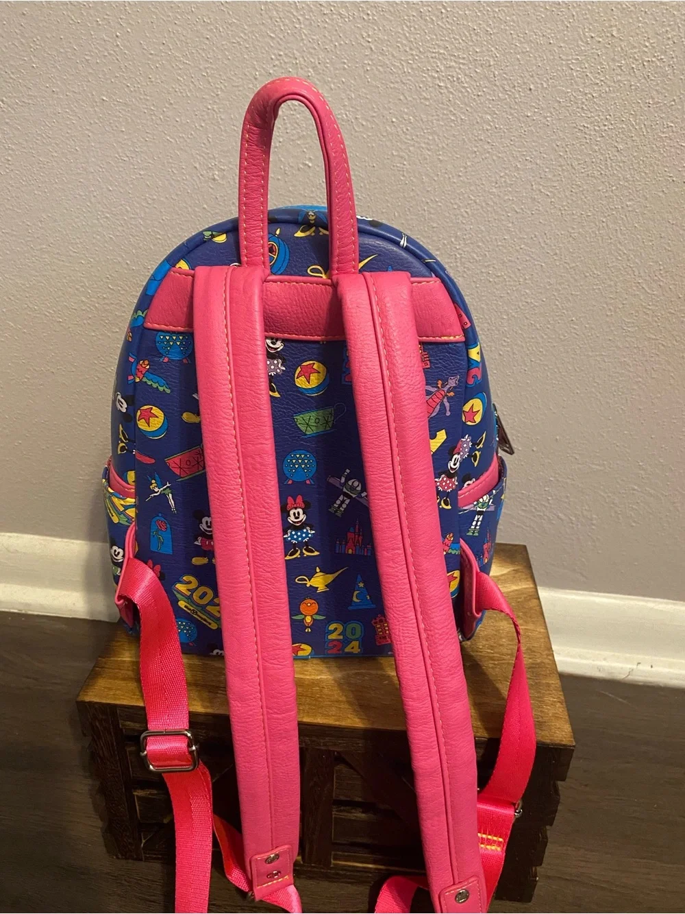 Loungefly Blue Mini Backpack with Pink Trim and Multicolor Disney Icons